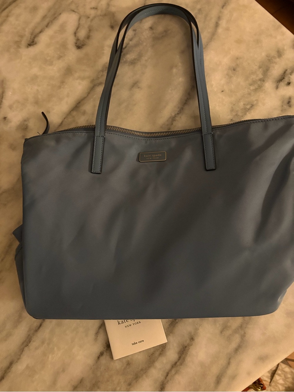 kate spade New York navy tote with gold hardware